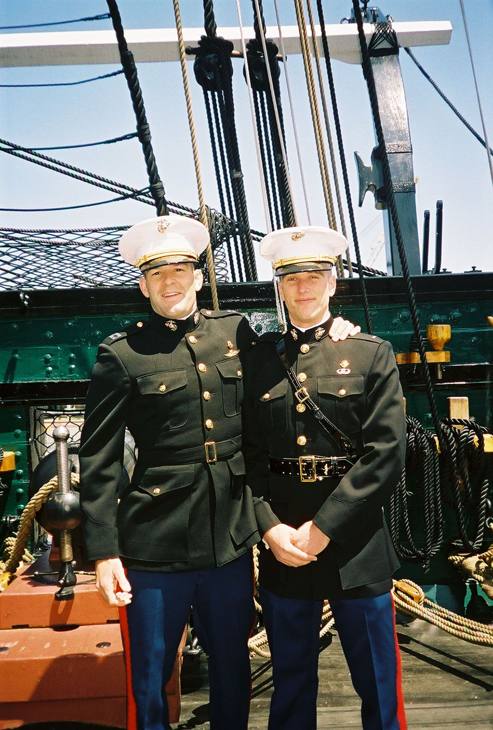 Elliot Ackerman and Douglas Zembiec in Marine dress blues aboard the USS Constitution, 2003.
