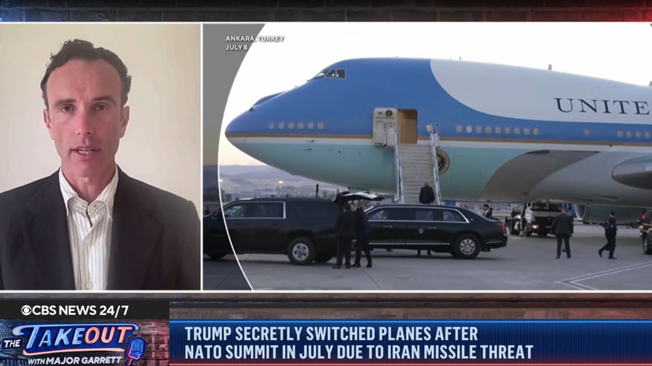 Elliot Ackerman discusses an Iranian threat to President Trump alongside footage of Air Force One in Ankara, Turkey, during a CBS News segment.