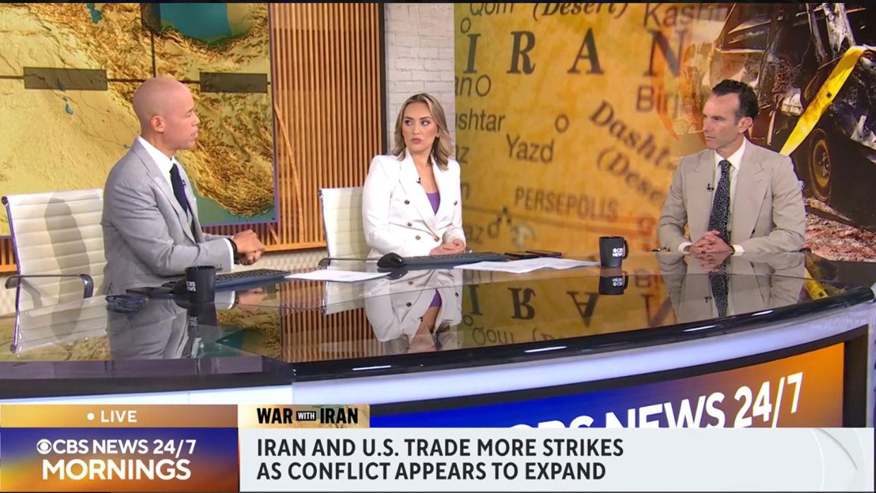 Elliot Ackerman appears on the CBS News 24/7 set discussing the expanding conflict involving Iran and the United States.