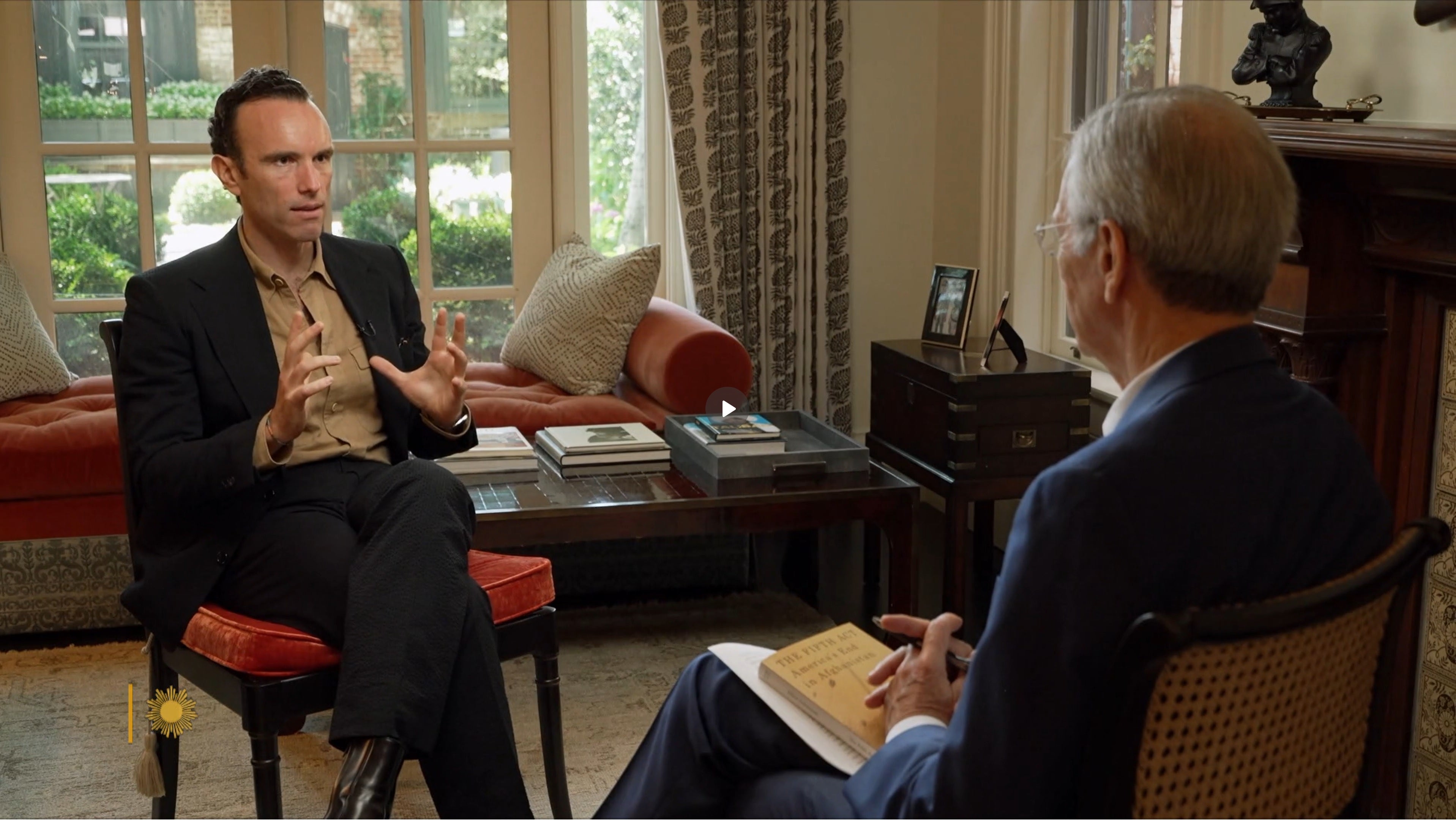 Elliot Ackerman speaking with CBS News correspondent David Martin during a CBS Sunday Morning interview about Afghanistan, the Taliban withdrawal, and his book The Fifth Act