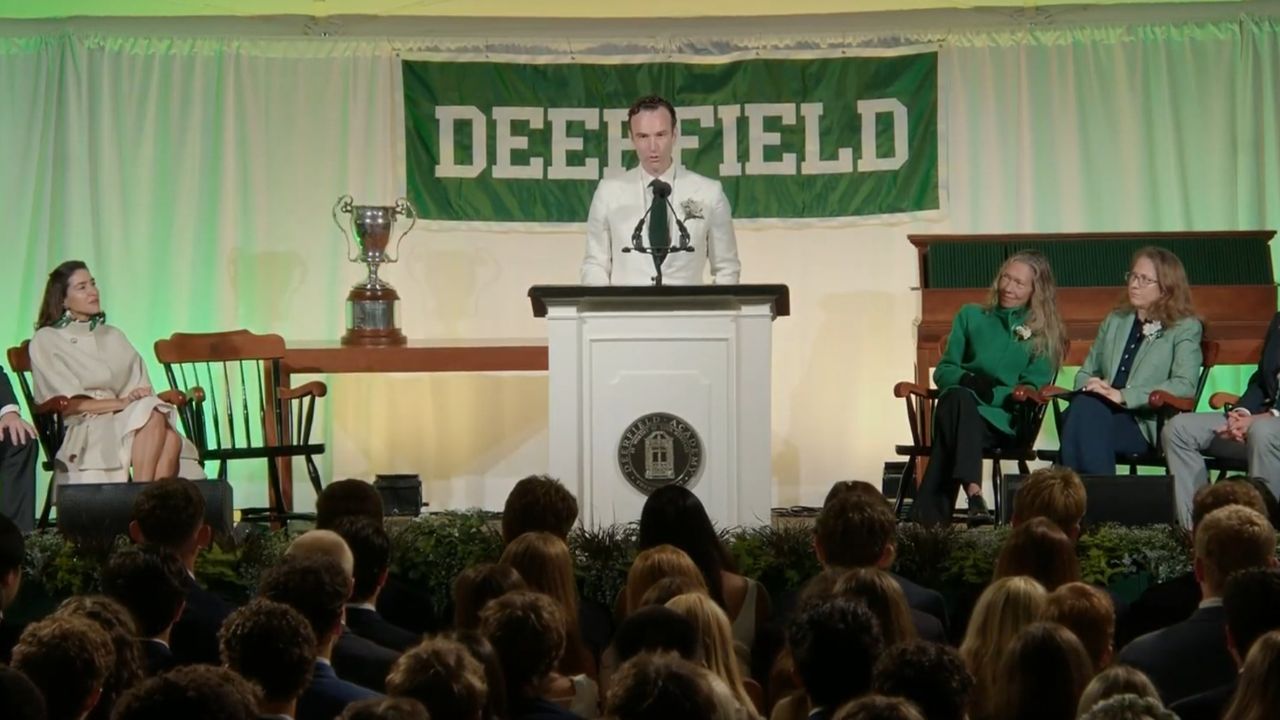 Elliot Ackerman delivers the 2026 Deerfield Academy commencement address from the podium before graduating students, faculty, and guests at Deerfield Academy in Deerfield, Massachusetts.