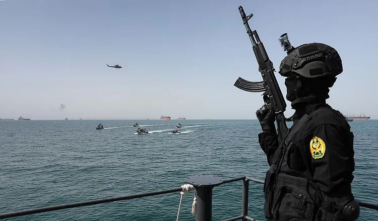 Iranian naval forces conducting military exercises near the Strait of Hormuz amid rising regional tensions