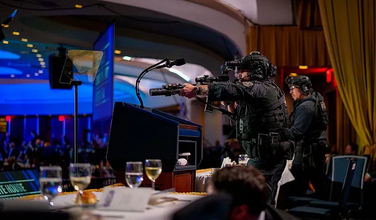 Federal security officers with rifles secure the White House Correspondents' Dinner ballroom at the Washington Hilton in Washington, DC, following a shooting incident near the event attended by journalists, government officials, and members of the media.