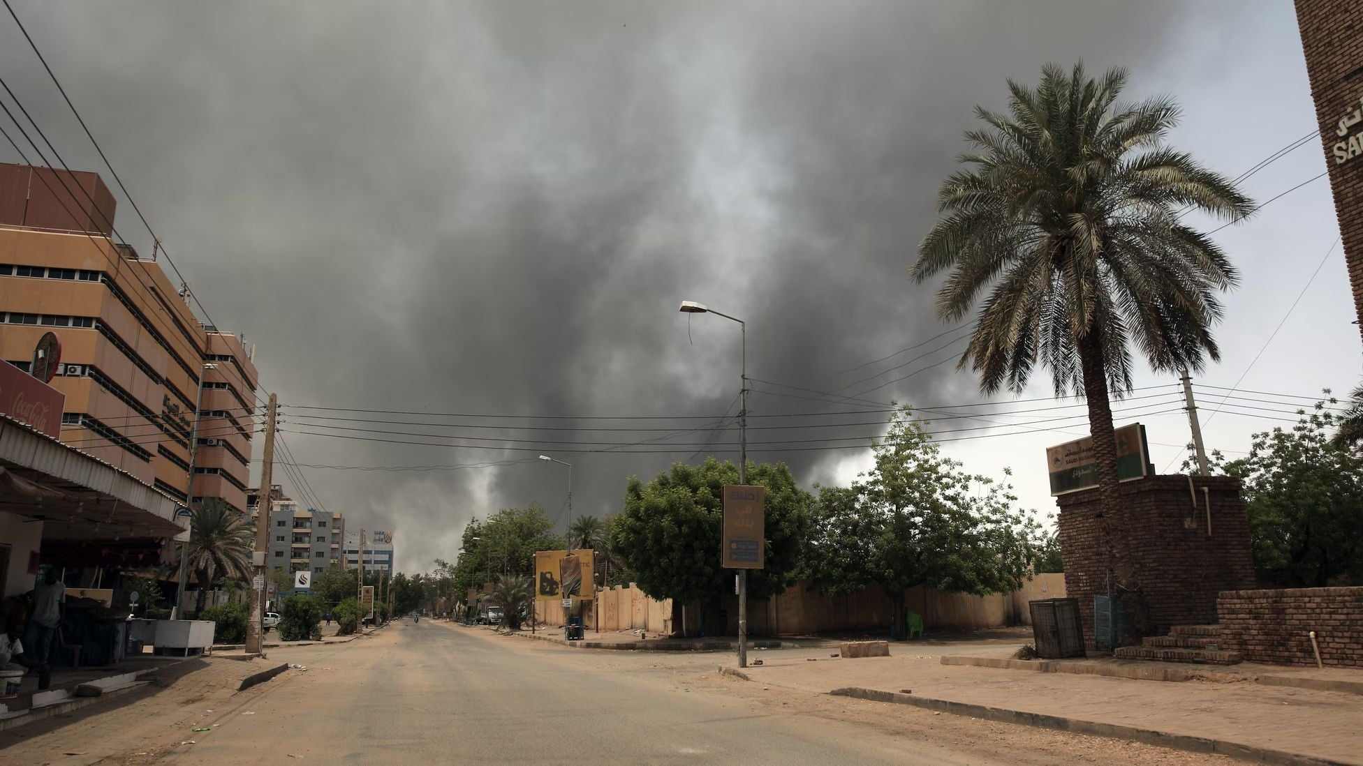 Dark smoke billows over the skyline of Khartoum, Sudan, as conflict erupts between rival military factions.